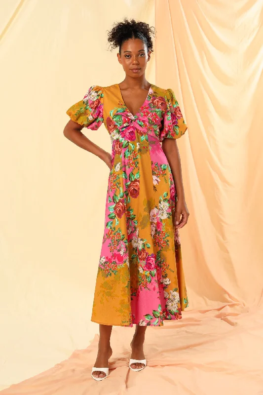 Maxi dresses with fringe trim for a bohemian vibeElena Twist front Maxi Dress