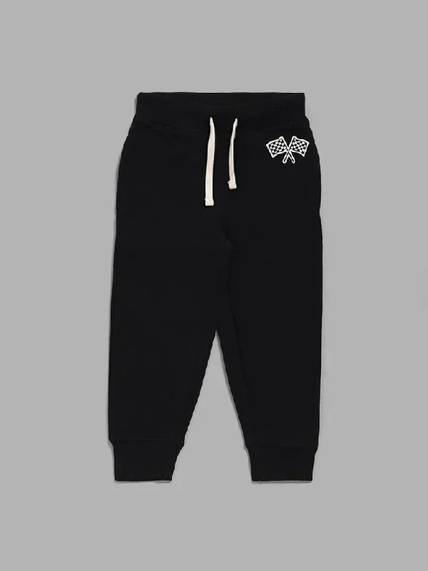 Belted Women Shorts to Enhance the WaistlineHOP Kids Black Track Flag Printed Joggers Belted Women Shorts to Enhance the WaistlineHOP Kids Black Track Flag Printed Joggers